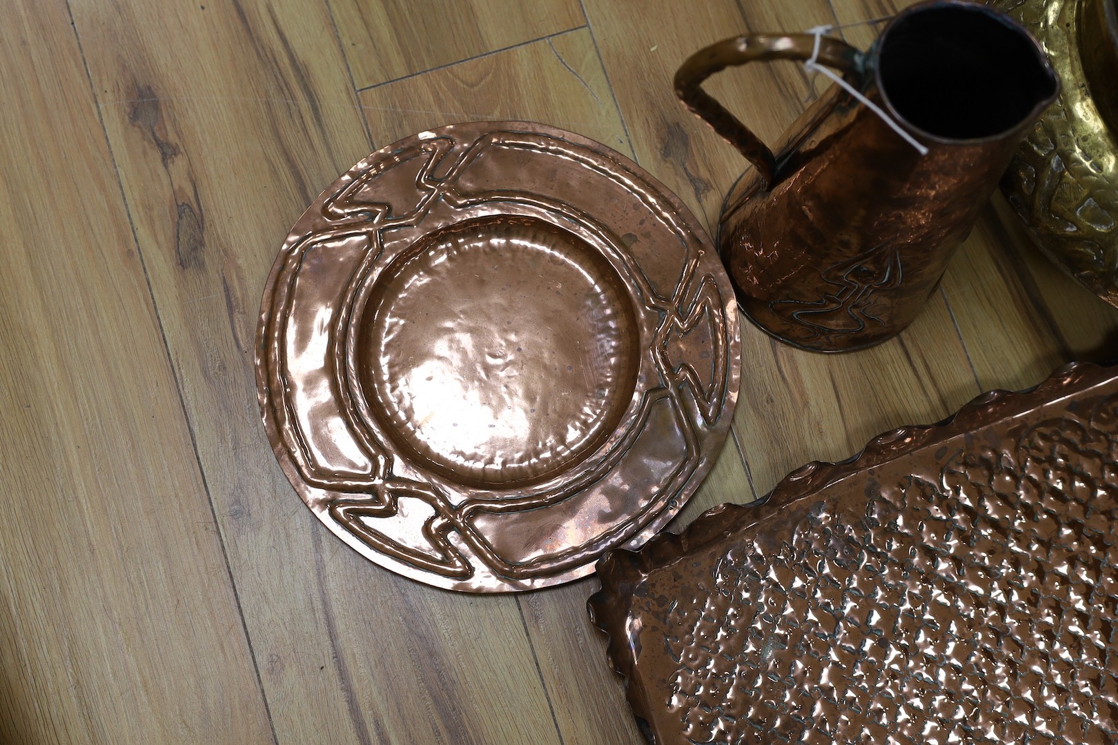 Metalware including embossed copper tray and jug, brass jardiniere, two mortars and pestle (7)